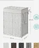 A white woven laundry basket with a lid and handles, shown with dimensions and capacity indicators. Produktbild-Vorschau