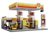 A detailed Lego-style model of a Shell gas station with a car wash and shop. Podgląd zdjęcia produktu