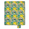 A flat lay of a picnic blanket with a tropical pattern. Produktbild-Vorschau