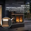 A black outdoor fireplace with wood storage, set on a wooden deck with plants in the background. Náhled obrázku produktu