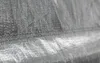 A close-up view of a gray tarp or fabric with visible stitching. Produktbild-Vorschau