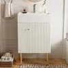A white bathroom vanity with a ribbed door and gold accents, set against a white paneled wall. Podgląd zdjęcia produktu
