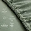 Close-up of a green fabric with text overlays describing its features. Produktbild-Vorschau