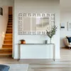 A hallway with a mirror, console table, and stairs. Náhled obrázku produktu