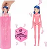 A hand is pulling a doll out of a glitter-filled container, with a separate doll and packaging shown. Náhled obrázku produktu