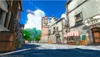 A street scene in a fantasy town with buildings, a clock tower, and a blimp in the sky. Produktbild-Vorschau