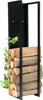 A black metal firewood rack filled with logs, with a green vine on the left side. Podgląd zdjęcia produktu
