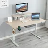 A home office setup with a standing desk, computer, and laptop. Produktbild-Vorschau