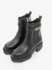 A pair of black Guess ankle boots with a chunky sole and gold logo detail. Voir les images du produit