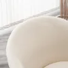 A close-up view of the textured fabric of a white chair. Produktbild-Vorschau