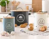 Three kitchen storage canisters for vegetables on a countertop. Produktbild-Vorschau