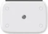 A top-down view of a white security camera with a gray metallic center. Voir les images du produit