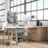 An office setting with a desk, chair, and computer. Produktbild-Vorschau
