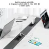 A desk with a built-in power strip featuring AC outlets and USB ports, with laptops and a smartphone connected. Produktbild-Vorschau