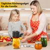 A mother and daughter are in a kitchen, preparing food and using a vacuum sealer for mason jars. Produktbild-Vorschau