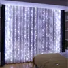 A bedroom with white curtains decorated with LED string lights. Náhled obrázku produktu
