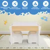 A children's table and chairs set with decorative elements on the wall. Produktbild-Vorschau
