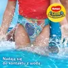 A child's legs in a swimming pool wearing swim diapers. Anteprima dell’immagine prodotto