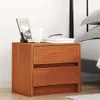 A wooden nightstand with two drawers next to a bed. Produktbild-Vorschau