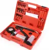 A red plastic case containing a vacuum pump kit with various attachments and a pressure gauge. Produktbild-Vorschau