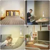 Collage of four images showing a levitating LED night light in different settings: a bedroom, a cafe, a living room, and a desk. Náhled obrázku produktu