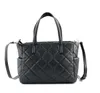 A black quilted handbag is shown against a white background. Náhľad obrázku produktu