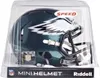 A mini football helmet for the Philadelphia Eagles, displayed in its clear plastic packaging. Produktbild-Vorschau