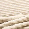 A close-up view of a soft, textured fabric with a ribbed pattern. Produktbild-Vorschau