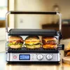 Three hamburgers are being grilled in a contact grill. Anteprima dell’immagine prodotto
