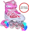 A pair of pink and white Apollo Super Blades roller skates with LED lights in the wheels. Produktbild-Vorschau