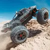 A remote-controlled monster truck is shown in action, driving over a dirt hill. Náhľad obrázku produktu