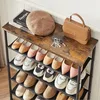 A shoe rack filled with various shoes, topped with a beret, books, and a handbag. Anteprima dell’immagine prodotto