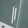 A close-up view of a shower door handle and part of the shower tray. Produktbild-Vorschau