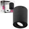 A black cylinder-shaped ceiling light is shown in the foreground, with its packaging in the background. Náhled obrázku produktu