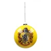 A yellow Christmas ornament with the Hufflepuff crest from Harry Potter. Produktbild-Vorschau
