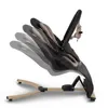 A baby bouncer chair shown from the side with multiple ghosted images indicating different reclining positions. Produktbild-Vorschau