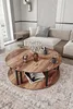 A living room scene with a couch and coffee table. Produktbild-Vorschau