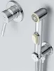 A chrome-plated bidet faucet set mounted on a light gray wall. Produktbild-Vorschau