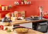 A kitchen scene with cookware, food, and kitchen appliances. Produktbild-Vorschau