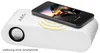 A white wireless stereo speaker with a smartphone placed on top, displaying a car image. Produktbild-Vorschau