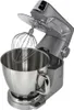 A silver stand mixer with a whisk attachment is shown against a white background. Voir les images du produit