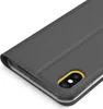 A close-up view of a dark gray flip case for a smartphone, showing the camera cutout with a yellow accent. Produktbild-Vorschau