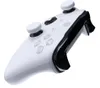 A white and black video game controller is shown against a white background. Produktbild-Vorschau