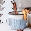 A cozy winter scene with a mug of hot beverage, cinnamon sticks, and Christmas cookies. Náhľad obrázku produktu