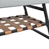 A close-up view of the woven leather straps on the lower shelf of a piece of furniture. Voir les images du produit