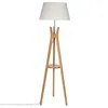 A floor lamp with a white shade and a wooden tripod base with a small shelf. Podgląd zdjęcia produktu