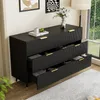 A black sideboard with gold accents is shown in a room with a window and a plant. Podgląd zdjęcia produktu