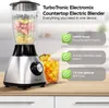 A countertop blender filled with fruit, next to a glass of iced beverage, with feature callouts. Produktbild-Vorschau