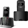 A black Maxcom senior-friendly mobile phone and its charging dock are displayed against a white background. Náhľad obrázku produktu