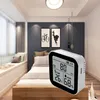 A digital air quality monitor placed in a bedroom setting. Náhľad obrázku produktu